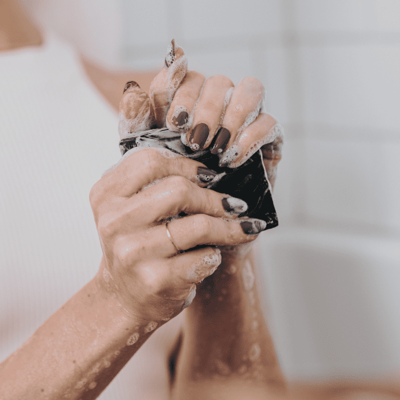 a set of beautiful hands being washed with the Knight body bar.